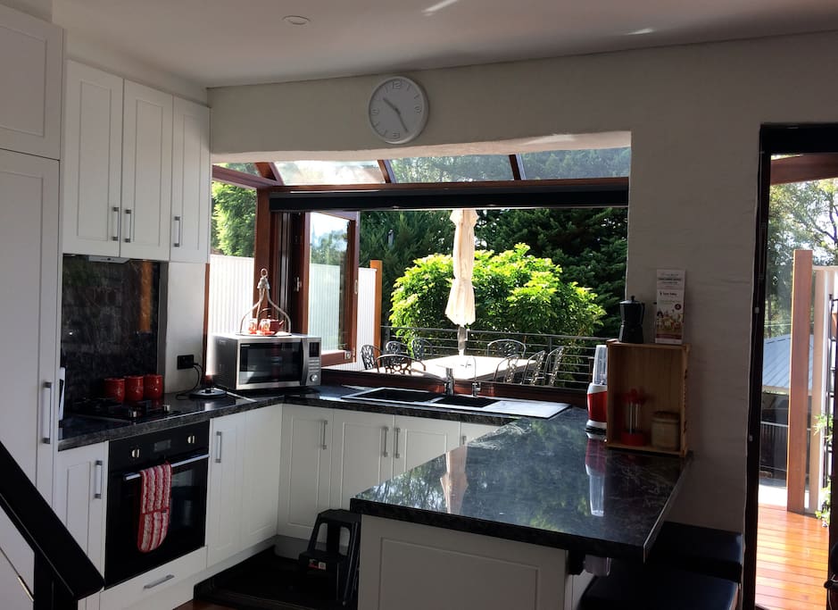 Fully equipped kitchen overlooking the deck