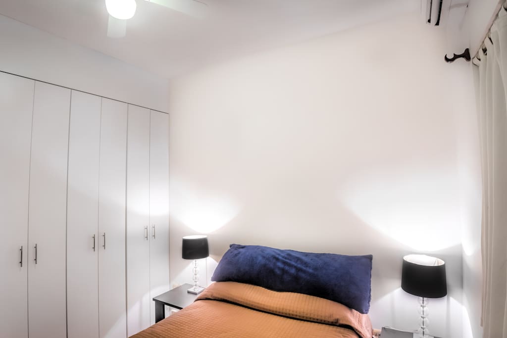 The room has a closet with enough space and hangers for a lot of clothes and baggage; There's a fan and the window has mosquito net in case you don't like A/C.