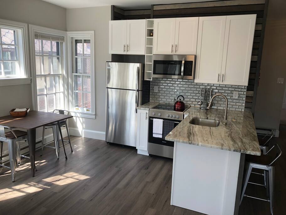 Open Brand New Kitchen w Bar and dining area