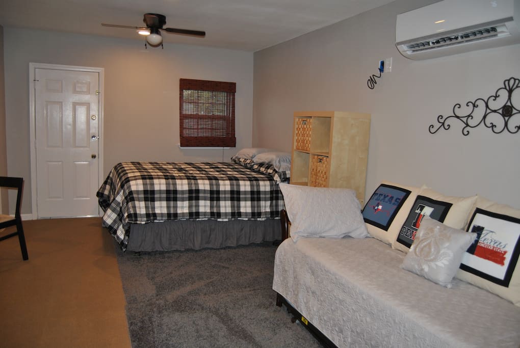 Comfortable bedding includes queen bed and day bed with trundle.