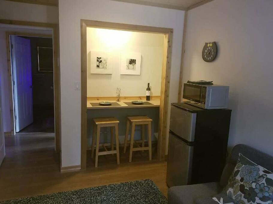 Inside your private lounge and dining space. Fridge, microwave, dining nook, sofa and TV with DVD and games library to enjoy!
