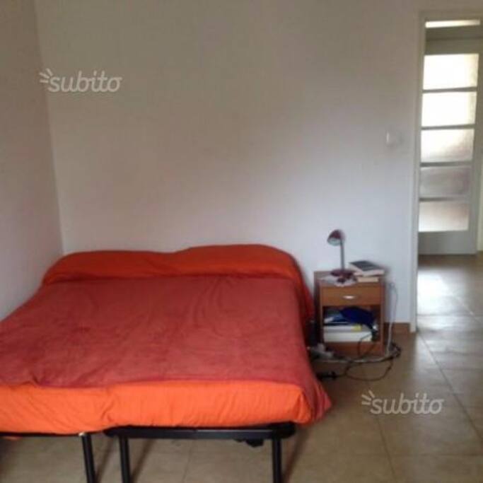 Big bedroom with furniture and doublesize bed.