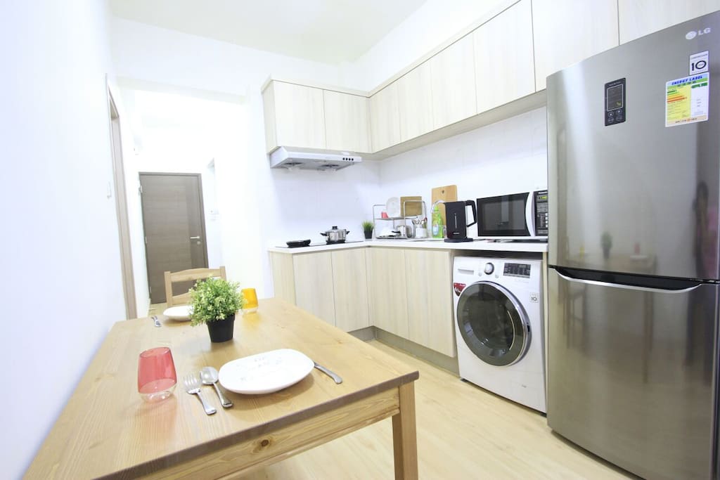 Living room is quite big with brand new washing machine, fridge and micro-wave.