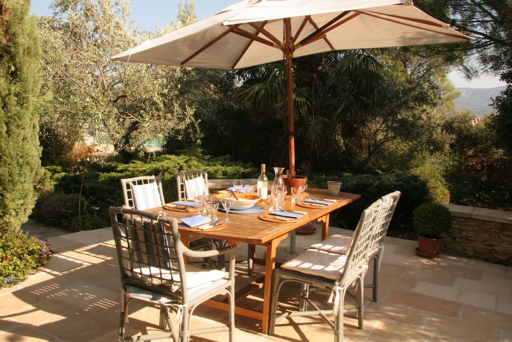 Dining patio, pool in background