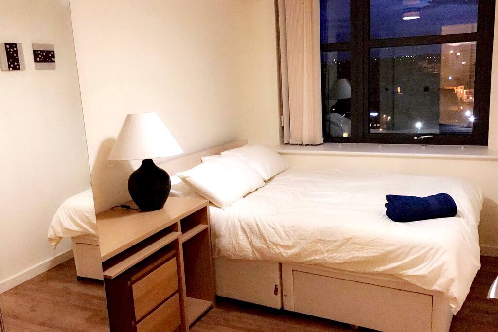 Spacious double bedroom with a desktop table, wardrobe & city view!!