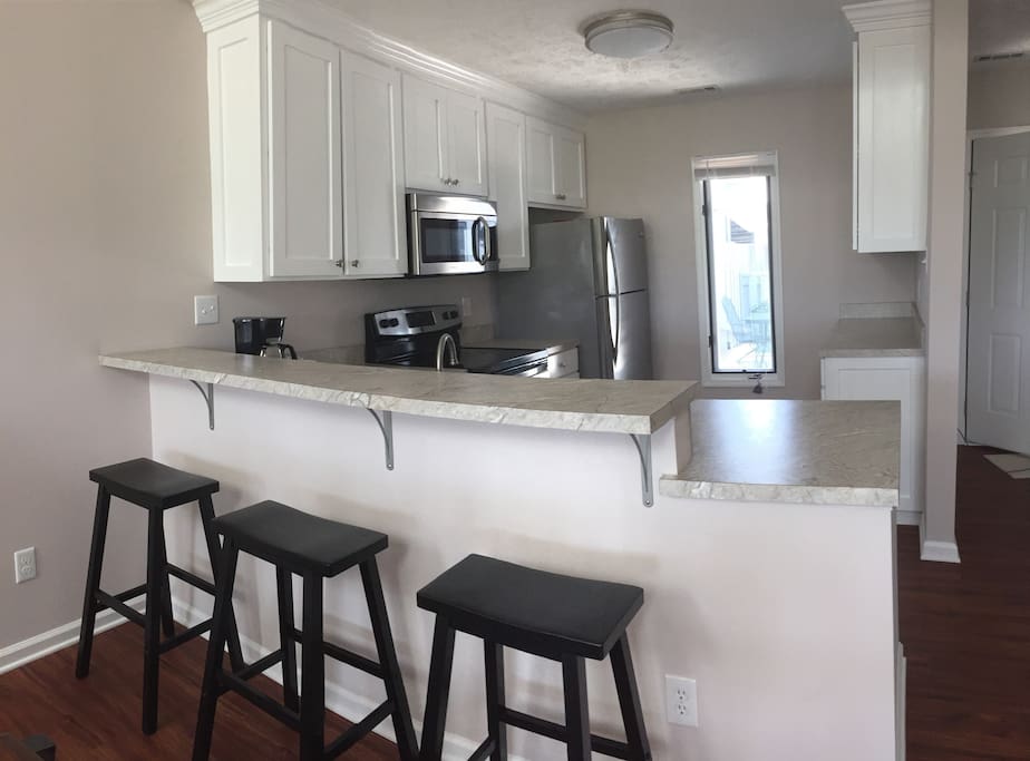 Remodeled, fully-equipped kitchen with high end appliances. Breakfast bar for 3.