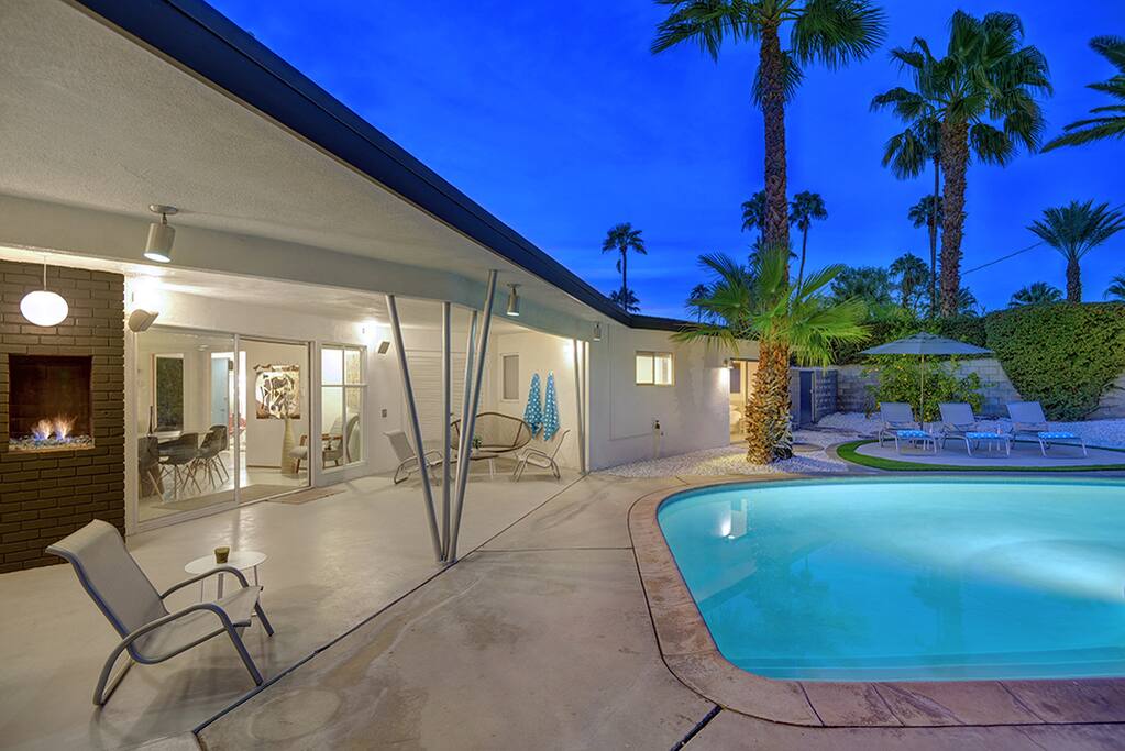 BACK OF HOUSE ANGLED AND POOL NIGHT - THE RETRO HOUSE - PALM SPRINGS VACATION RENTAL POOL HOME