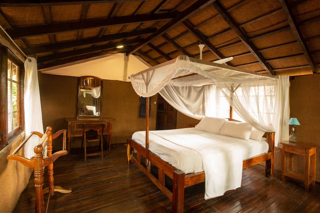 Hut inside with king size bed, comfortable metres and mosquito net