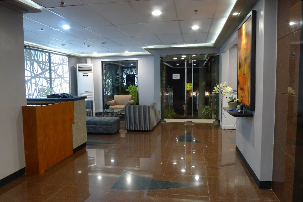 Lobby with marble floors and seating reception