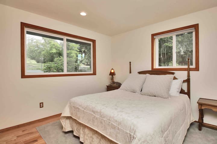 Upstairs bedroom with backyard view 