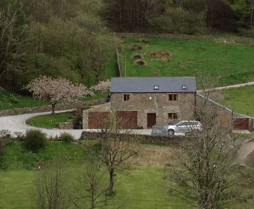 Fairthorn Barn at the top of the outbuildings.