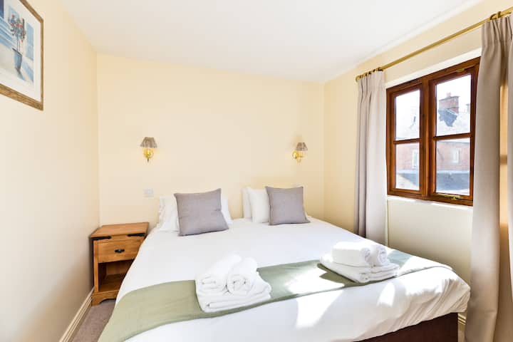 Bedroom one has an en-suite shower and can be made up with either super-king bed or twin beds. Double wardrobe, bedside cabinet & dressing table. You can relax in bed with the TV. The calm décor makes you feel at home instantly.