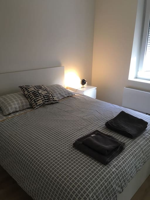 double room with queen size bed with 1 wardrobe, mirror, and a dresser