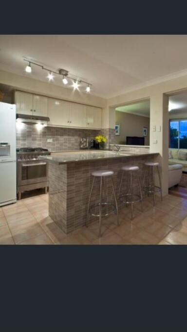 Cook in the chefs kitchen & entertain in the open plan living space.