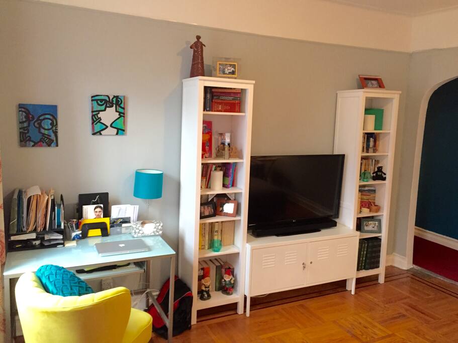 Desk to work from, book collection, and 42" flat screen TV with Cable and Apple TV