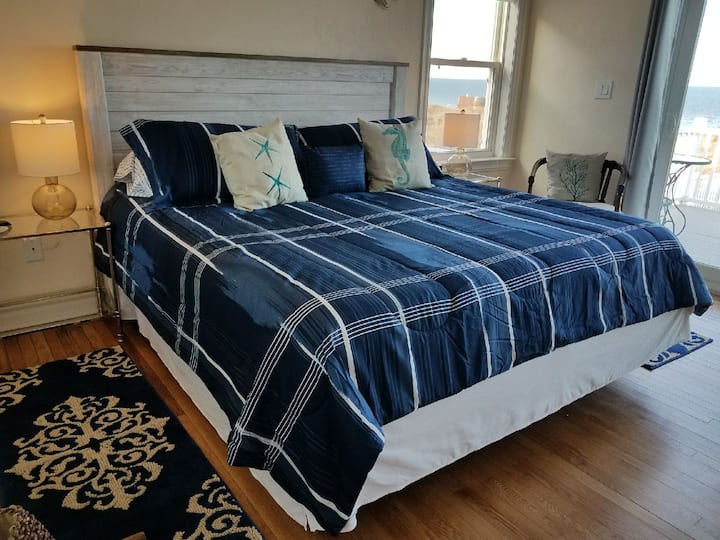 Master Bedroom with deck over looking the Chesapeake Bay, adjoining master bath