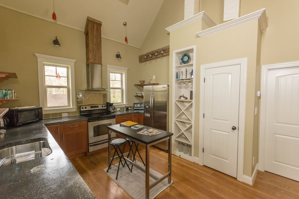 Kitchen, wine rack, pantry, washer/dryer behind door to the right.