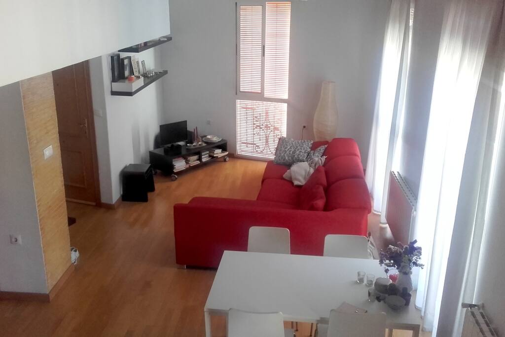 Open space living room, the red sofa can be turned into a bed!