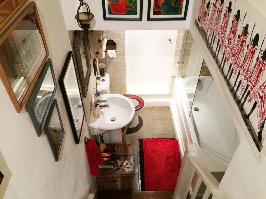 The shared bathroom, with bath, shower, toilet and basin.