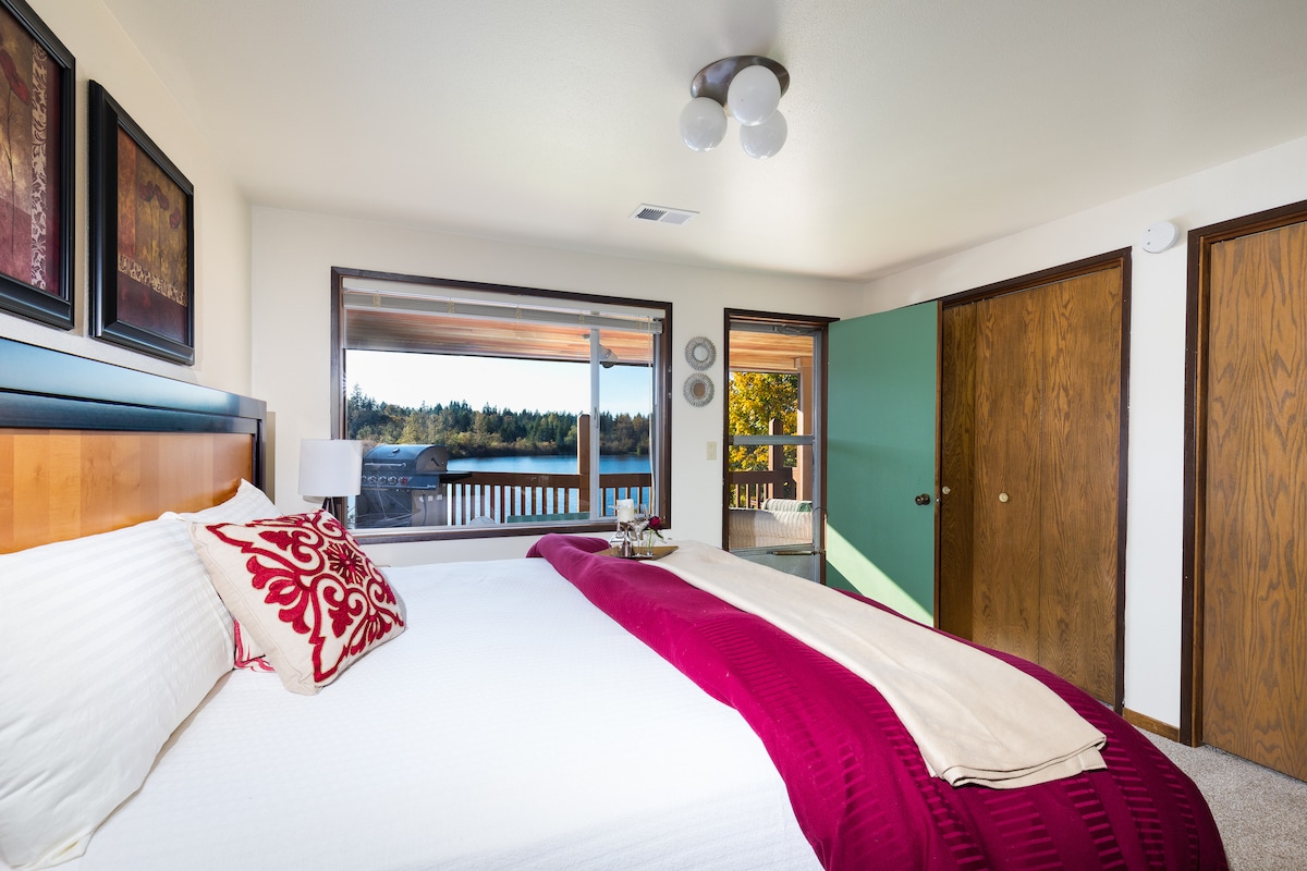 Master bedroom is first on the left with a beautiful King bed. You can see the view with a door to the covered deck.