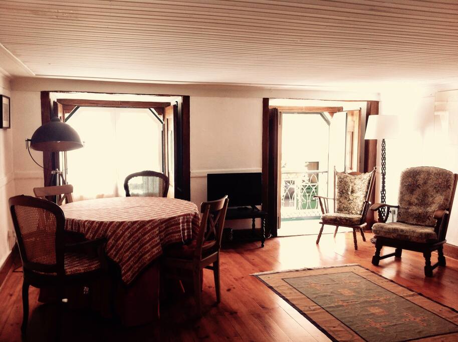 The Living Room: The two windows give the room a beautiful natural daylight.The windows are facing a small street, and the double windows protect from noise, making it quiet and comfortable. It includes a flat panel TV with +100 channels.