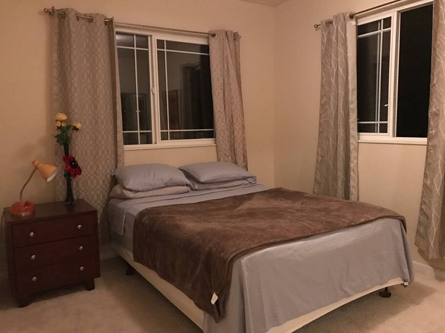 first bedroom with queen size bed