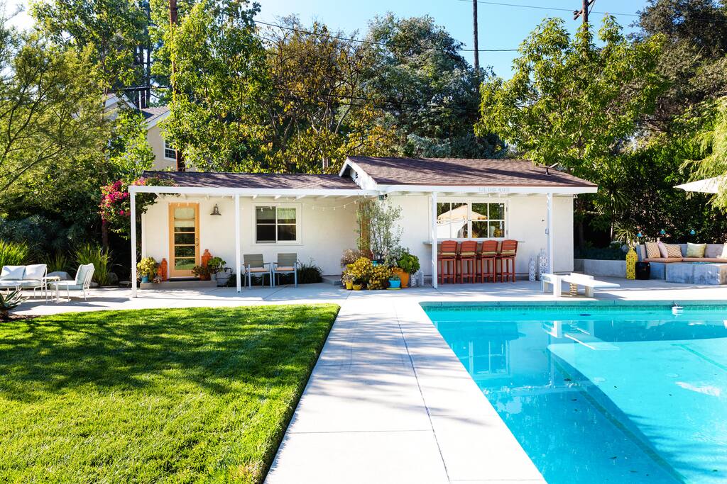 Exterior of guest house and pool.