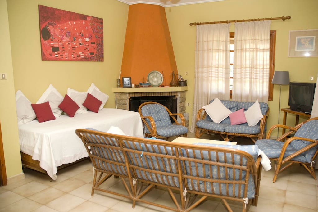 Lounge with door and window to the garden