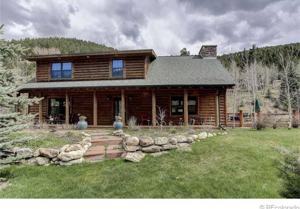 Large front porch just feet from the river