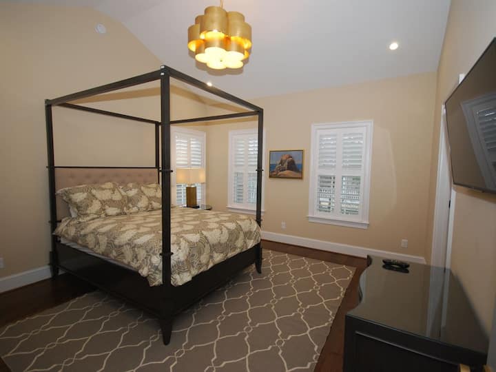 Bed 8 boasts a queen four poster bed, television, ensuite bath and vaulted ceilings.
