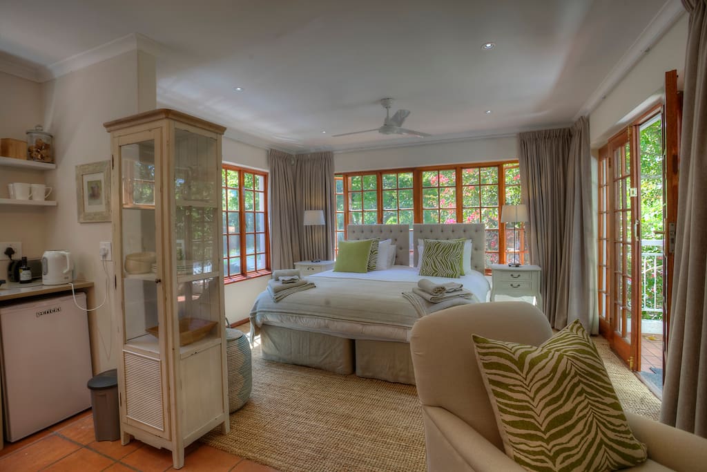 Fabulous king size bed and open plan to lounge and kitchen.