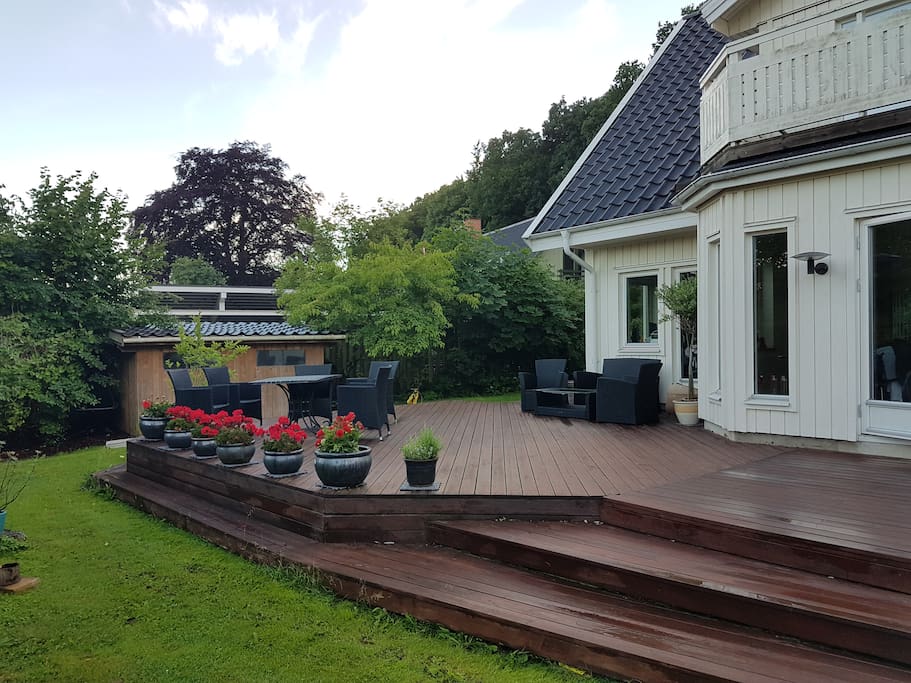 Big front terresse with a big Weber BBQ, two tables for 9 pers. and outdoor sofa