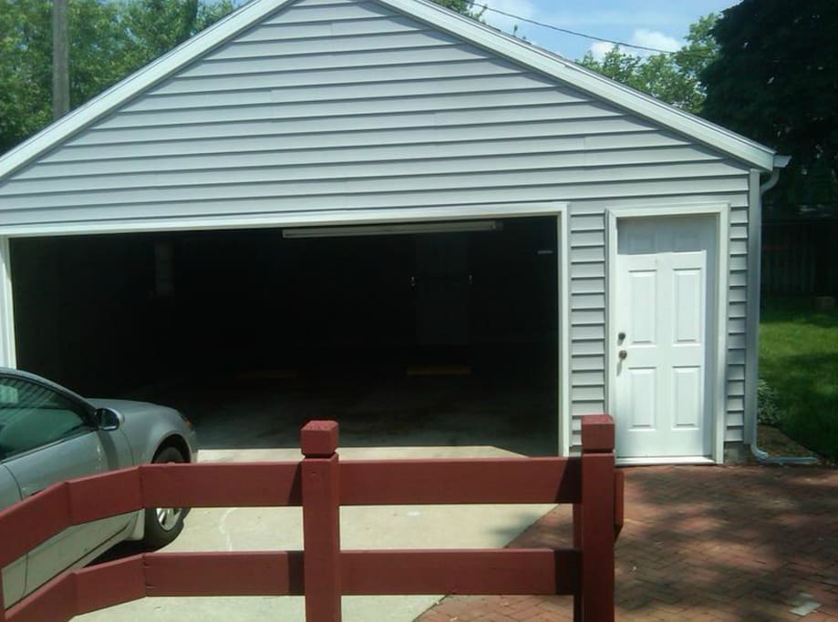 Deck to Backyard - BBQ Grill and Table on it. Large 2 Car Garage with Storage and Tailgate Accessories (Refrigerator, Tables, Chairs, Ice Chest, Coolers, 32" HDTV) for Inclement Weather.