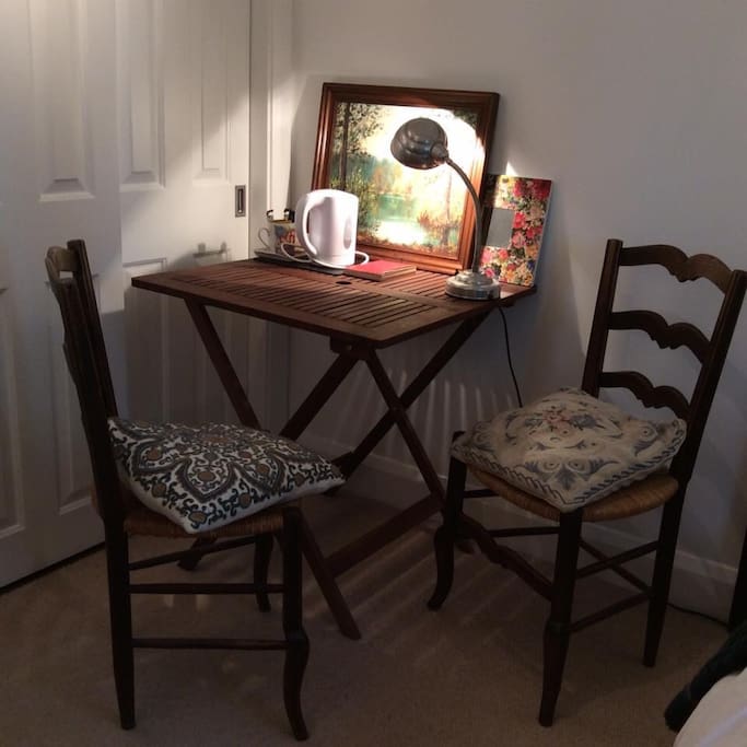 Card table with two chairs in one room