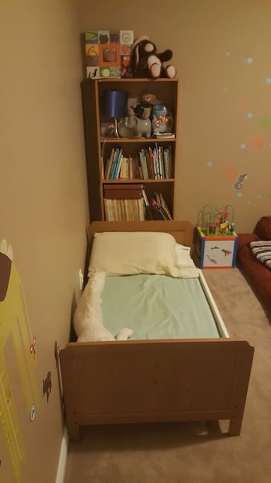 Toddler bed in the kids room.