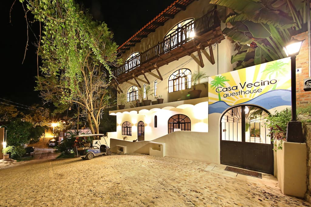 Entrance of Casa Vecino by night. Our entrance features a secure coded door look and lots of outdoor lighting to help you find your way