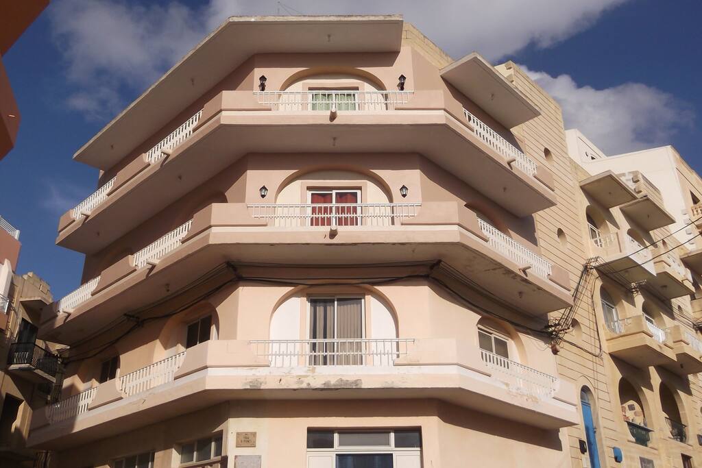 Façade. Apartment is on the top floor