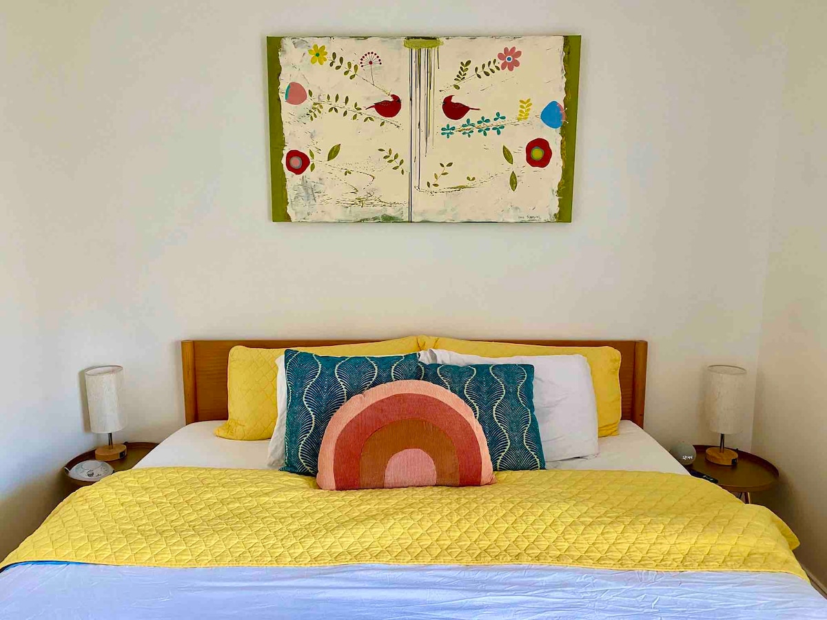 King size bed in main bedroom. Lots of comfy blankets and pillows. All linens including comforter and quilts are washed each stay. Access to outside from bedroom. 