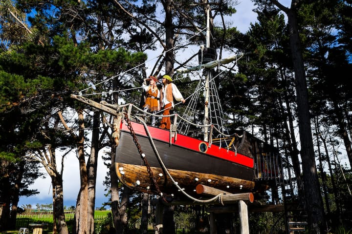 pirate ship treehouse with picnic tables