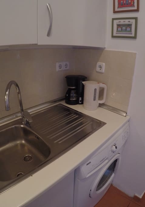 Kitchen is fully equipped, with both coffee maker and water boiler, as well as an easy-to-use laundry machine.
