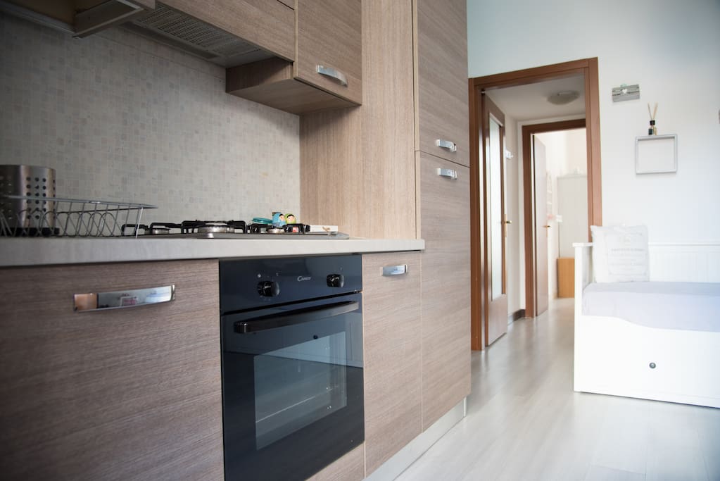 living room with double bed/kitchen/tv