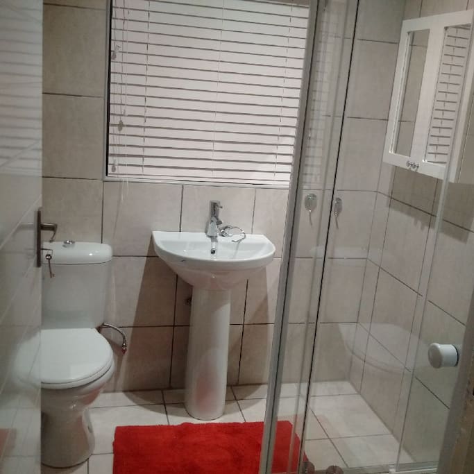 Brand new bathroom tiled to ceiling with extractor fan