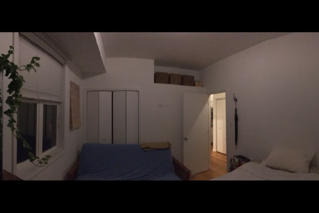 Looking around bedroom from far corner.