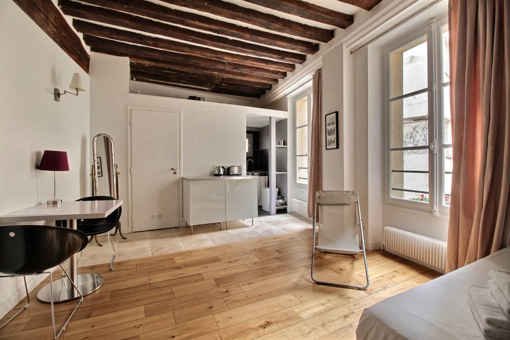 Living room with large double bed and TV