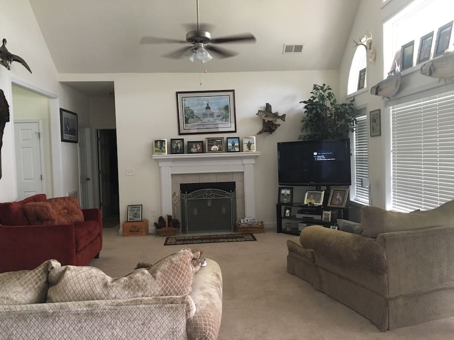 Den with fireplace and large tv