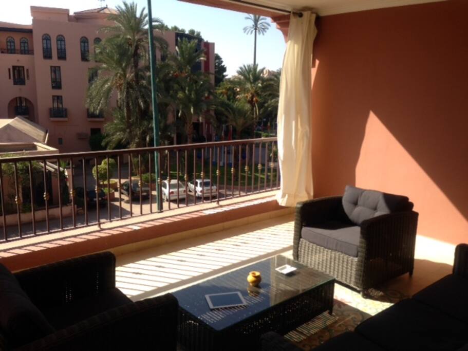 Large balcony with curtains