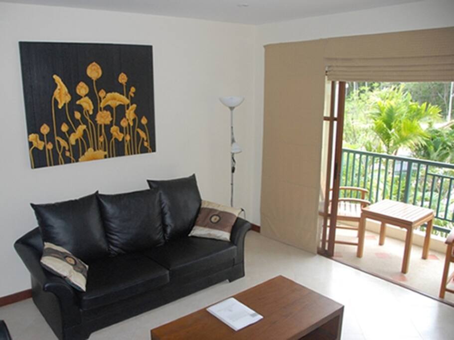 Lounge with large screen TV and HiFi opposite