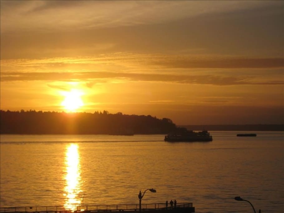 Sunset; ferry boat views await you from the living/dining room and master bedroom!