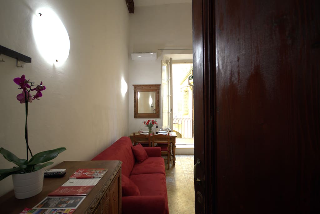 Living area with Sofabed for 2 persons, Air Conditioning, Lcd TV, Wifi internet, table and chairs, bathroom, little kitchen, balcony, stairs for the second level.