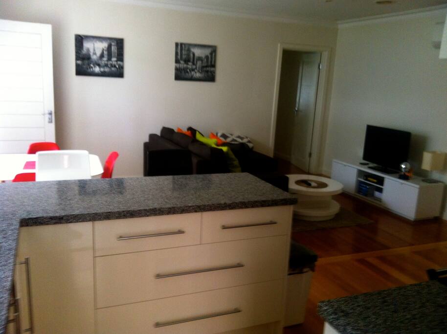 Spacious and modern open plan dining, living and kitchen area.